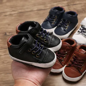 Detailed macro view of soft leather baby high-top pre-walker shoes in multiple colors