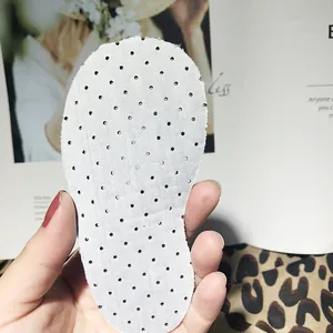Detailed macro view of white breathable perforated insole for toddler baby walking shoes