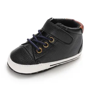 Detailed side view of high-top black leather baby walking shoes with soft soles