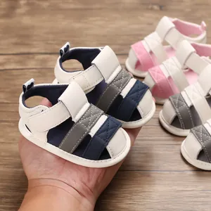 Soft-soled baby sandals for summer toddlers held in hand to show the size details