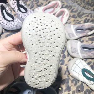 Macro detail of anti-slip rubber sole for toddler sock shoes with breathable holes