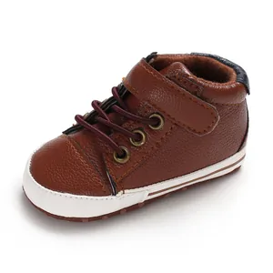 Detailed view of brown faux leather high-top baby walker shoes with a soft sole
