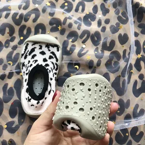 Detail showing the soft and non-slip sole of leopard print baby walker sock shoes
