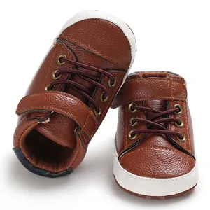 Close-up of brown high-top baby walker shoes with soft soles and velcro straps