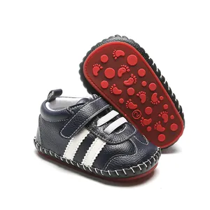 Chaussures bébé premier pas semelle souple en caoutchouc avec bandes blanches