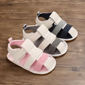 Detail view of infant baby soft sole walking sandals in pink, grey, and navy blue colors
