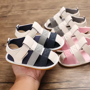 Close-up view of lightweight baby summer sandals with soft soles in various colors on wood