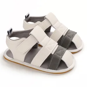 Detailed view of white and grey baby summer sandals featuring soft non-slip soles