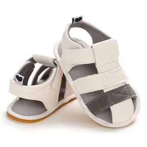 Close-up view of soft-sole baby summer sandals with velcro straps and grey panels.