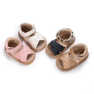 A collection of four colored soft sole walking sandals for baby girls this summer