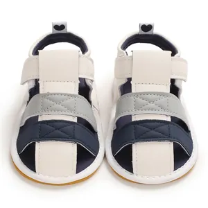 Front view of color-block baby sandals with soft soles and heart heel pulls.