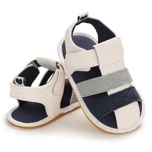 Soft-sole baby sandals for 0-1 year olds, featuring navy and grey patchwork design.