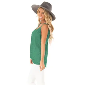 Detailed side view of a green sleeveless tank top with a stylish knot detail for women.
