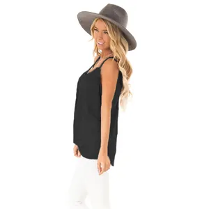 Side view of black sleeveless tank top featuring a stylish twist knot detail