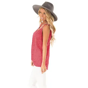 Side view of woman wearing a red heather knit sleeveless tank top and grey fedora hat