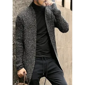 Detail of men's long-sleeve knit cardigan showing texture and relaxed fit on model