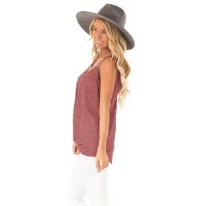 Side view of a sleeveless red tank top paired with a stylish wide-brimmed grey hat.