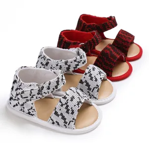 Close-up of soft-sole breathable baby walker shoes in stylish houndstooth patterns