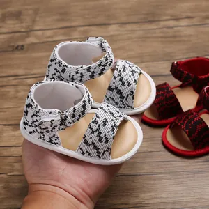Detail view of breathable soft-sole baby walking sandals with houndstooth pattern