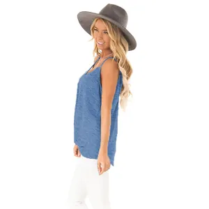 Side view of a sexy blue sleeveless summer tank top worn with a wide-brimmed grey hat.