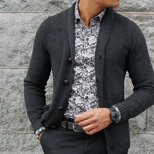 Detailed shot of charcoal grey men's chunky knit cardigan with single-breasted buttons