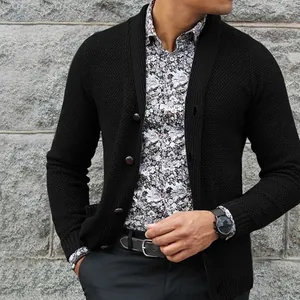 Detail shot of a black men's single-breasted knitted cardigan paired with a floral shirt
