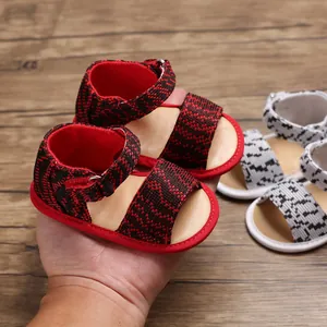 Close-up of baby pre-walker sandals with soft soles and breathable woven fabric