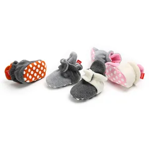 Detailed view of various colorful soft-sole winter baby booties with plush fabric