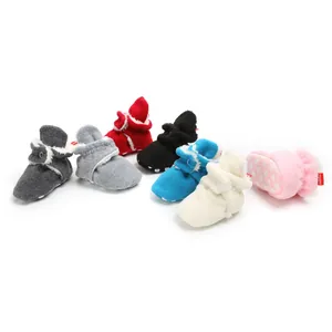 Multi-color winter baby fleece booties with soft non-slip soles for warm pre-walking.