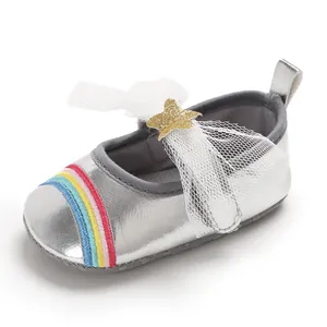 Detail view of silver baby girl soft sole pre-walker shoe with rainbow pattern
