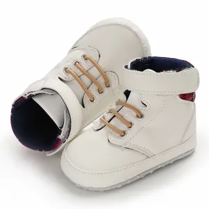 Detailed view of white soft-sole high-top baby toddler shoes with hook-and-loop strap