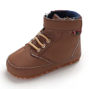 Close-up view of brown high-top baby walking shoes for infants with soft non-slip soles