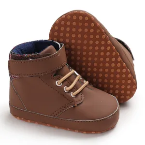 Detailed view of high-top baby walking shoes featuring soft non-slip dotted soles