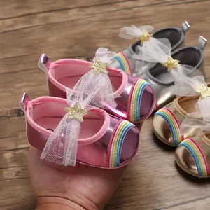 Detailed view of metallic baby girl princess walker shoes with rainbow toe and star mesh bow