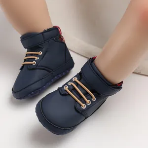 Close-up of navy blue baby pre-walker shoes with soft soles and velcro straps
