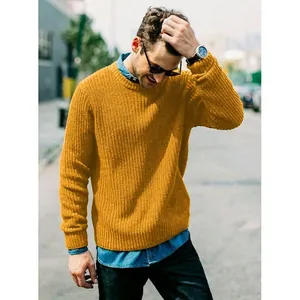Detailed view of a mustard yellow slim fit chunky knit men's pullover sweater