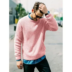 Detail view of men's pink slim fit crewneck knitted sweater on model