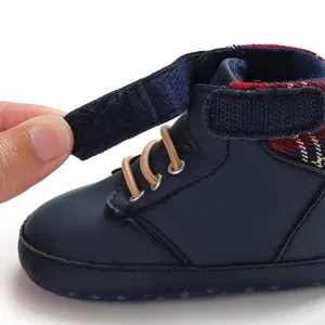 Close-up of baby high-top walker shoe showing adjustable velcro strap closure