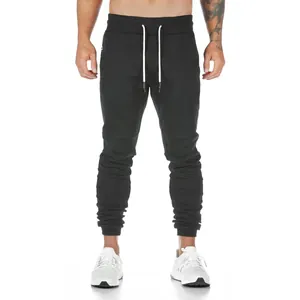 Close-up of men's black slim-fit cotton joggers for gym training and running