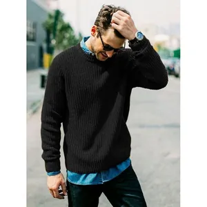 Close-up showing the ribbed knit texture of a black crewneck sweater on a male model