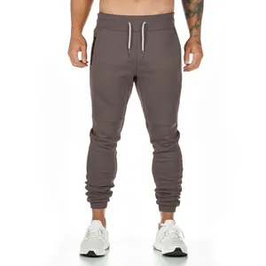 Men's slim fit cotton sports joggers in dark grey for gym training and running exercise.