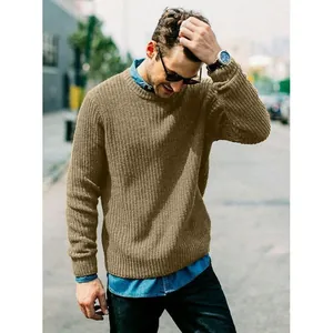 Detail of men's khaki ribbed knit pullover sweater in an urban setting
