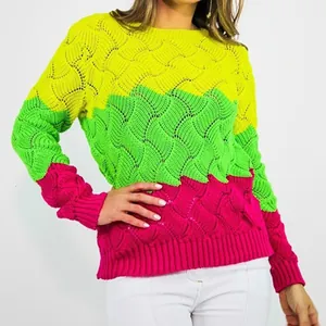 Close-up detail of vibrant wavy rainbow crochet knit sweater featuring intricate patterns