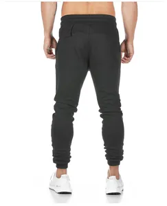 Back view of men's slim-fit black cotton joggers for fitness and running training.
