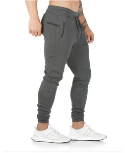 Side view of dark grey slim-fit cotton joggers for men's professional fitness training