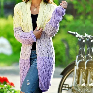 Detail of woman wearing long purple and yellow color-block cable knit cardigan