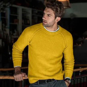 Detailed look at the vibrant yellow crew neck knit sweater texture on male model