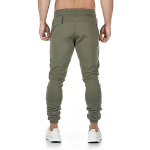 Rear view of olive green slim-fit cotton joggers for men's fitness training.