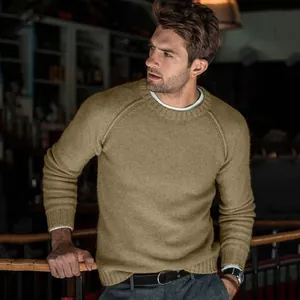 Detail view of men's khaki knit sweater showing crewneck design and raglan sleeves