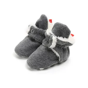 Cozy grey winter baby booties with soft sole and warm faux fur lining for walking infants